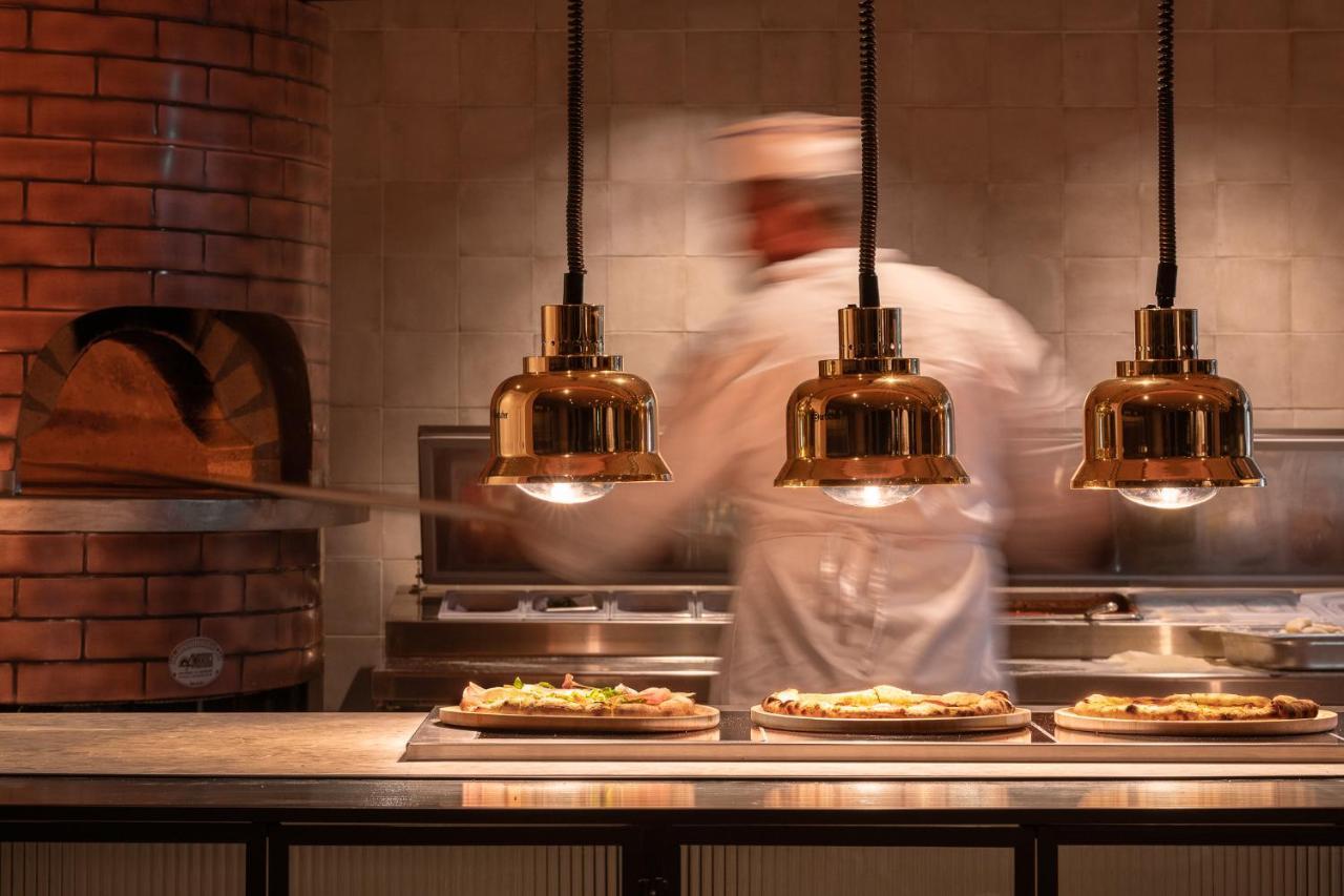 Helea Lifestyle Beach Resort Kallithea  Exterior photo Pizzas being prepared at a restaurant